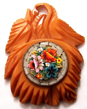 BN38  carved butterscotch bakelite pendant w mosaic center